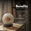 Crystal ball with engraved design on a wooden surface, labeled with benefits.