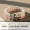 Stack of beaded bracelets with silver beads on a beige surface