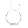 moonstone thread bracelet with white stones and gold beads on a white background