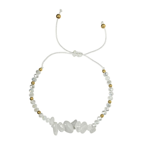 moonstone thread bracelet with white stones and gold beads on a white background