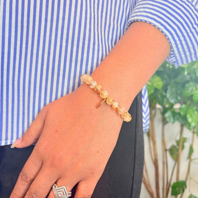 woman wearing Natural Citrine Bracelet on left hand