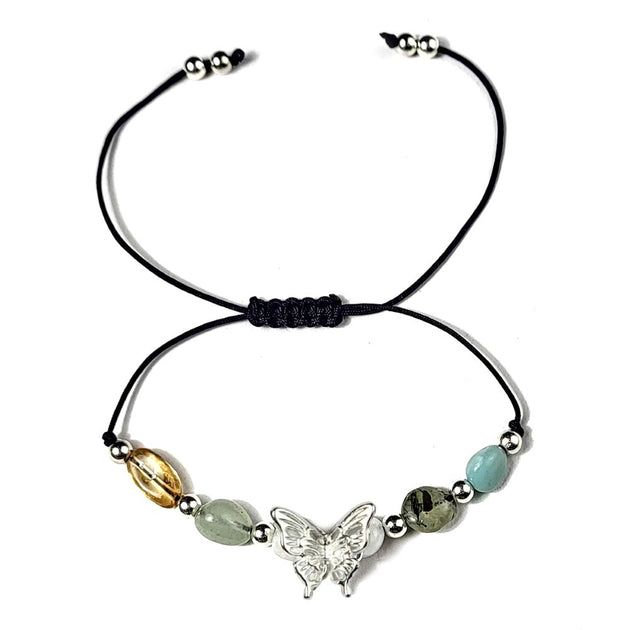 Bracelet with butterfly charm and colorful beads on a white background