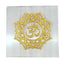 decorative selenite plate with golden om design on a white background
