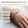 Hand wearing a peach moonstone crystal bracelet with text on emotional healing and self-love.