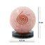 Pink crystal ball with a spiral design and measurements on a white background