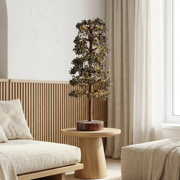 Decorative indoor plant on a wooden table in a modern living room.