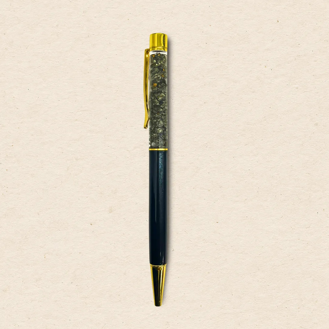 Pen with black and gold accents on a beige background