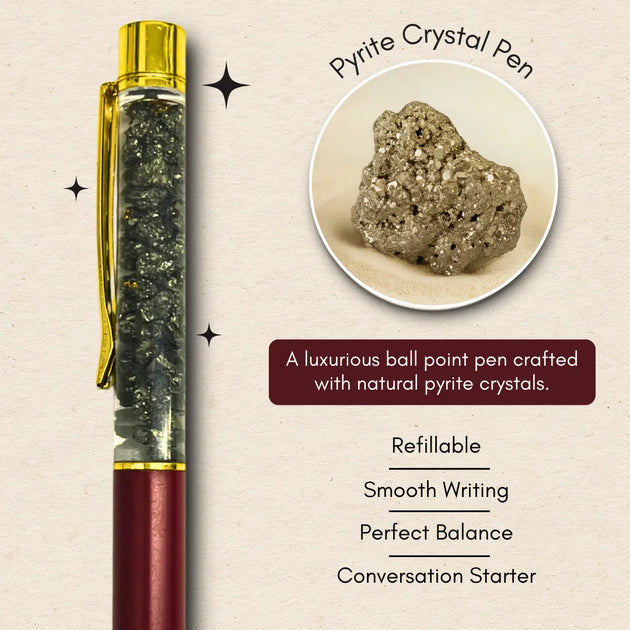 Pyrite crystal pen with natural pyrite crystal inset on a beige background