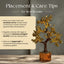 Decorative gold tree with placement and care tips on a neutral background