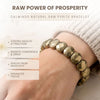 Bracelet with pyrite beads on a wrist, labeled 'Raw Power of Prosperity' by Calminds.