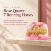Pink rose quartz showpiece with seven golden running horses and a sun