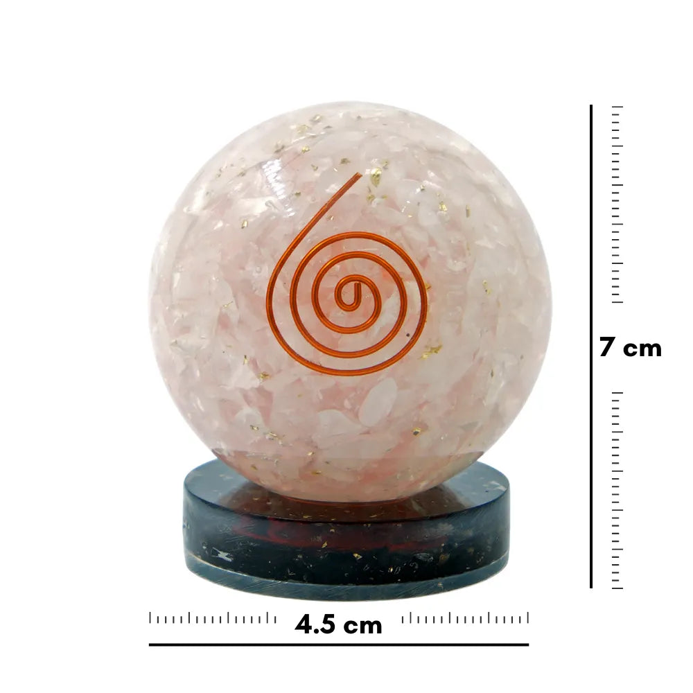 Pink crystal ball with a spiral design on a black stand, accompanied by measurements.