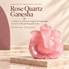 Pink rose quartz Ganesha idol on a stone slab