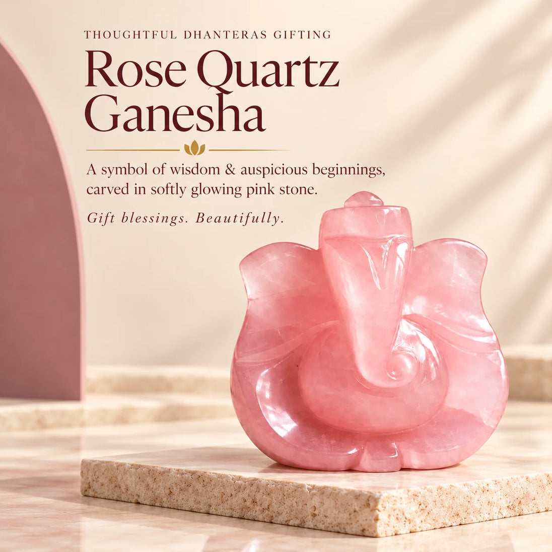 Pink rose quartz Ganesha idol on a stone slab