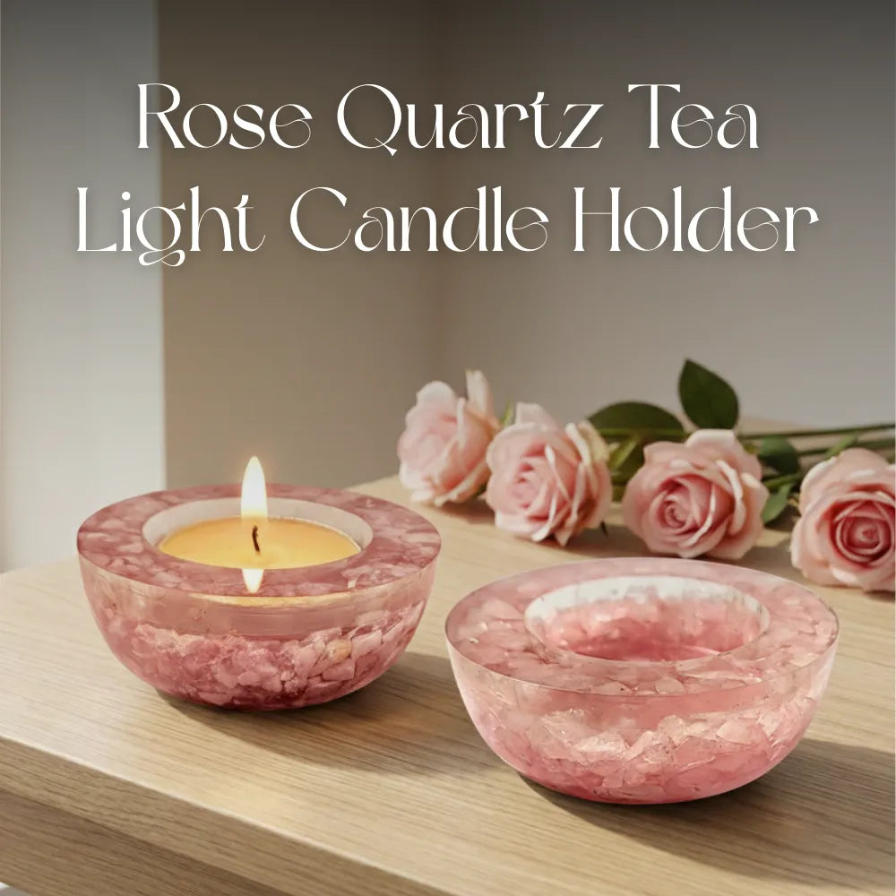 Rose Quartz Tea Light Candle Holder with a lit candle and pink roses on a wooden surface.