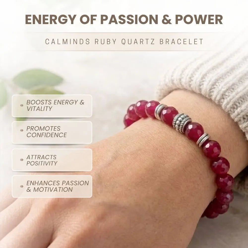 Red beaded bracelet on a wrist with text about energy and power, worn by a person.
