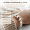 White crystal bracelet on a wrist with text about energy cleansing and clarity.
