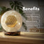 Decorative crystal ball with geometric design on a wooden surface, labeled with benefits.
