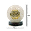 Crystal ball with gold geometric design on a white background with measurements.