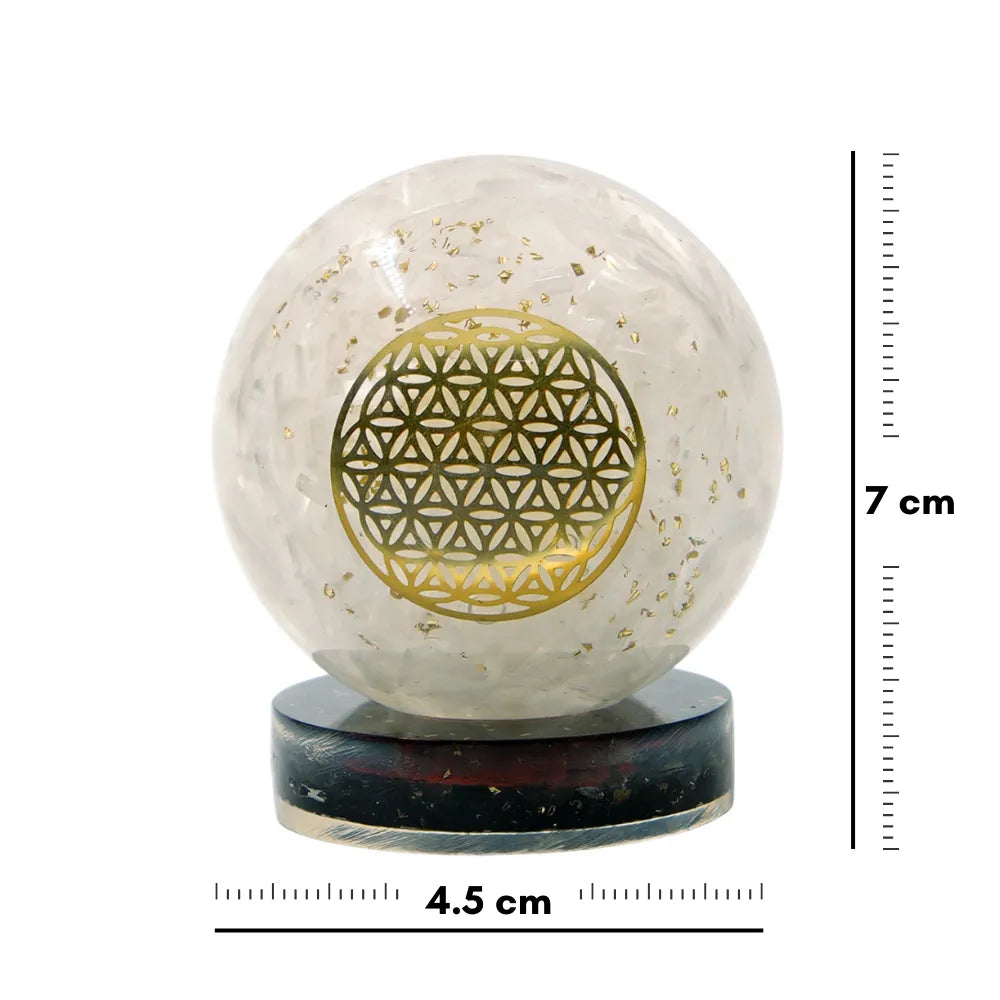 Crystal ball with gold geometric design on a white background with measurements.