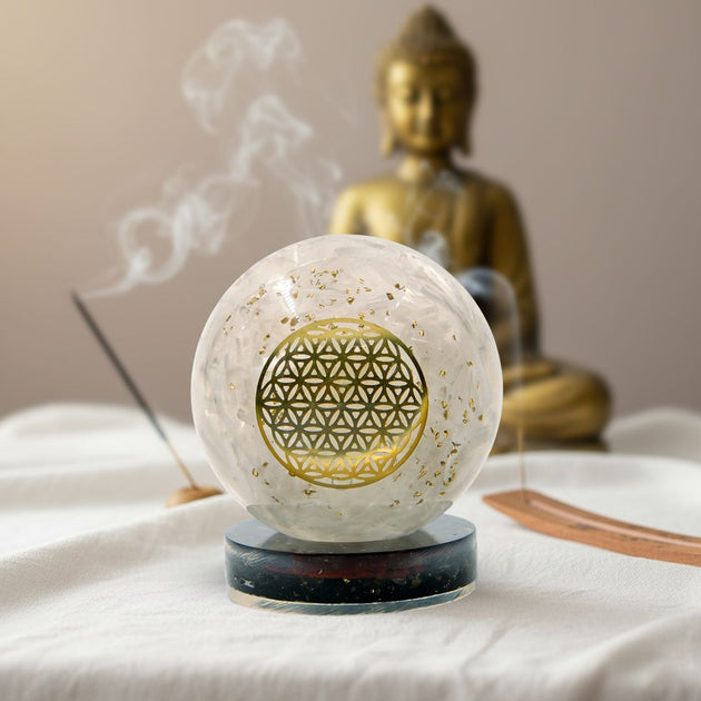 selenite orgonite ball on a black tourmaline stand