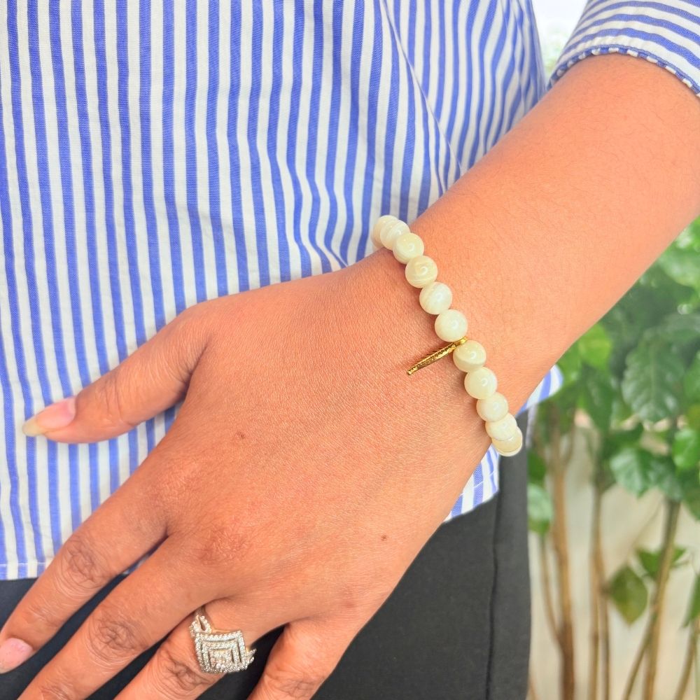 woman wearing a Selenite Crystal bracelet on her left hand