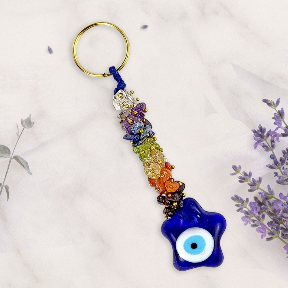 Colorful keychain with a blue evil eye charm on a white background