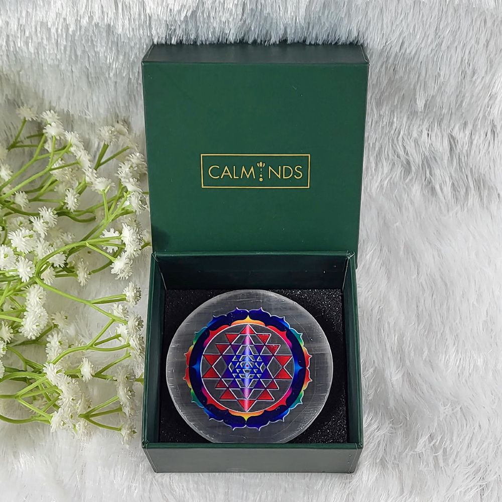 decorative item with a geometric design in a calminds box on a white background