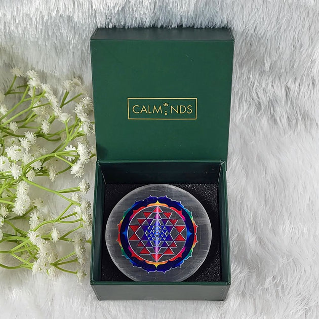 decorative item with a geometric design in a calminds box on a white background
