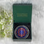 decorative item with a geometric design in a calminds box on a white background