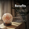 Crystal ball with a spiral design on a wooden surface, labeled with benefits.