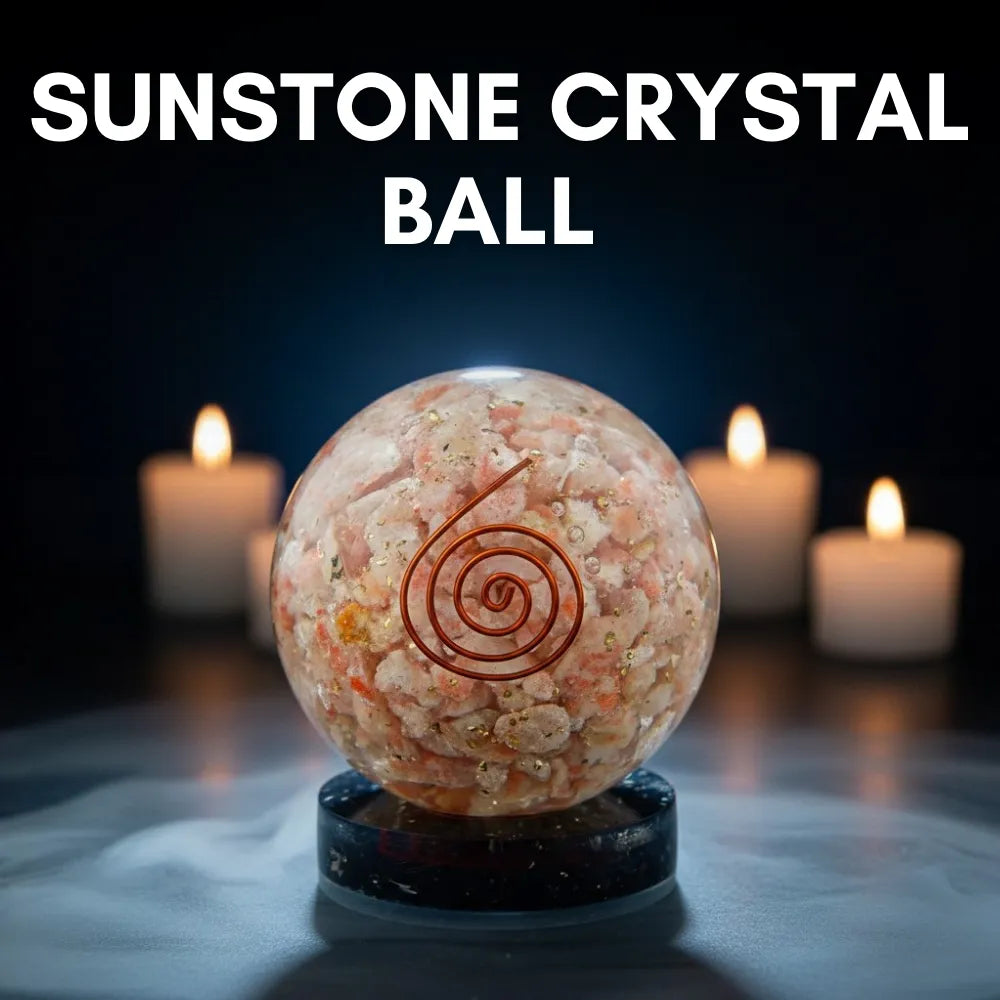Sunstone crystal ball with a spiral symbol on a dark background with candles