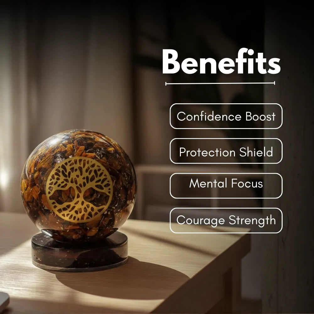 Crystal ball with tree of life design on a wooden surface, labeled with benefits.