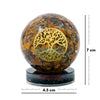 Decorative sphere with tree of life design on a white background