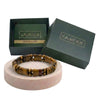 Bracelet on a pink stand with Calminds branded box and guide book in the background