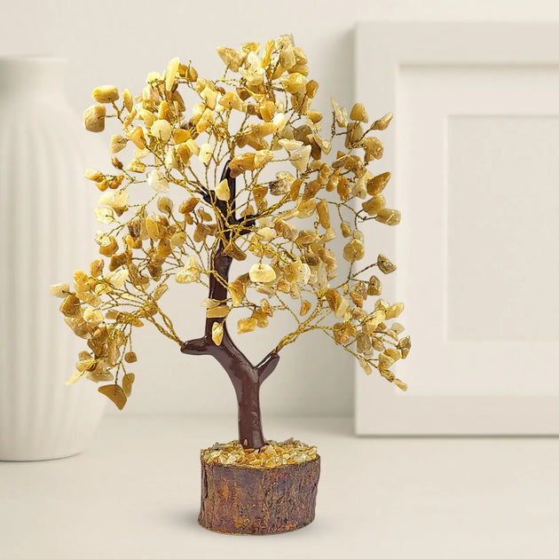 Decorative tree with gold leaves on a neutral background