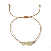 Bracelet with natural yellow quartz stone beads on a white background